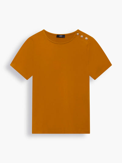 “Pearl” button-embellished classic T-shirt in Amber. This T-shirt comes in a warm, rich amber shade, an enduring hue that is understated yet sophisticated. Gold-tone faux pearl buttons along one shoulder add a charming touch.