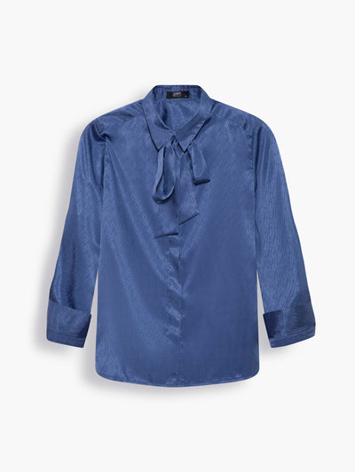 Satin Shirt with Necktie in Azure Blue. Comes in a liberating shade of blue, this design has a more polished look with its tailored fit and neatly concealed buttons. Pair it with the matching satin pleated skirt or the necktie with jeans and oversized sunglasses.